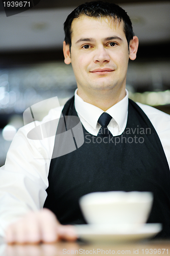 Image of Barista prepares cappuccino