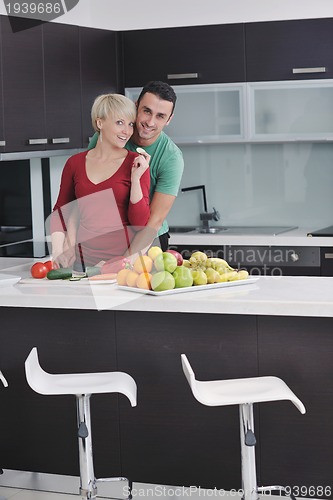 Image of young couple have fun in modern kitchen