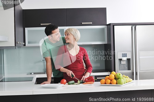 Image of young couple have fun in modern kitchen