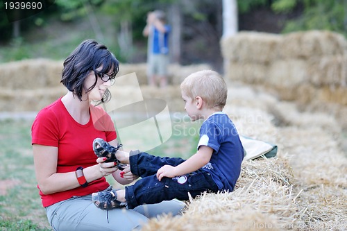 Image of woman and child have fun outdoor