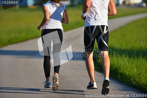 Image of Young couple jogging