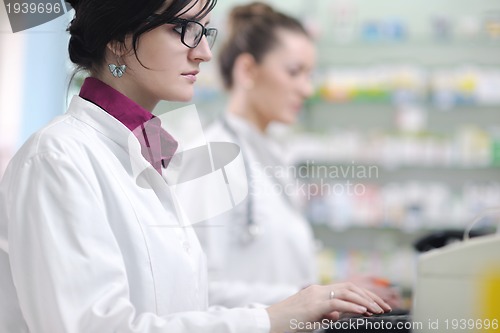 Image of team of pharmacist chemist woman  in pharmacy drugstore