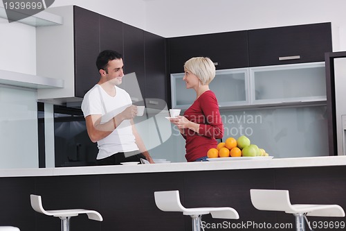 Image of young couple have fun in modern kitchen