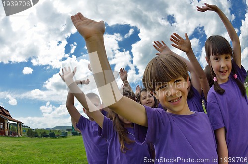 Image of happy kids group  have fun in nature