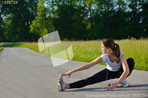 Image of woman stretching before fitness