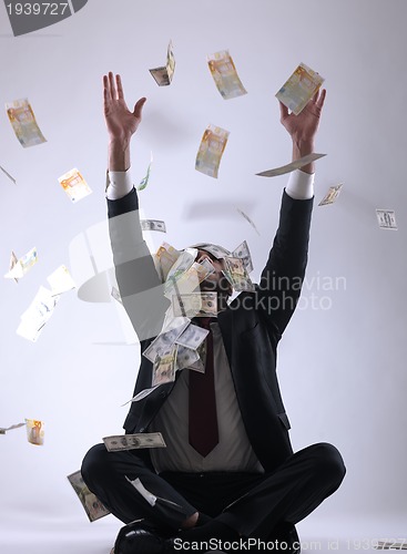 Image of Business man holding money