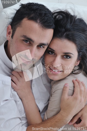 Image of happy young couple relax at home