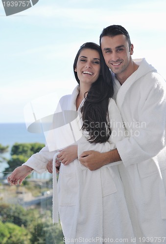 Image of couple relaxing on balcony