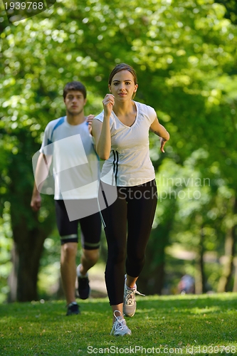 Image of Young couple jogging