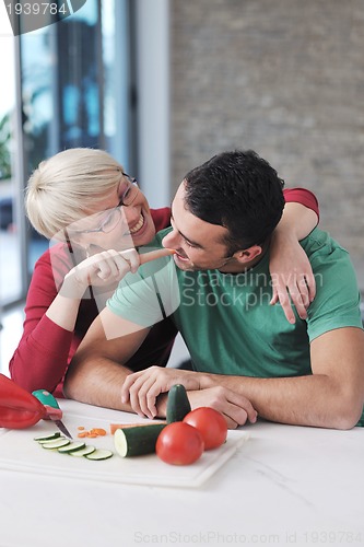 Image of young couple have fun in modern kitchen