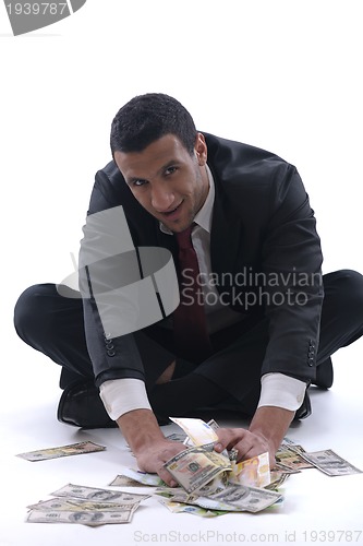 Image of Business man holding money