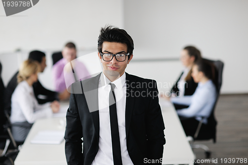 Image of young business man at meeting