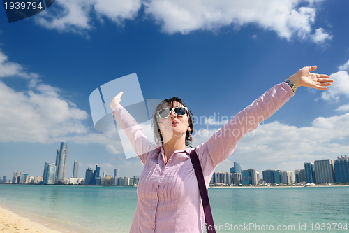 Image of happy tourist woman