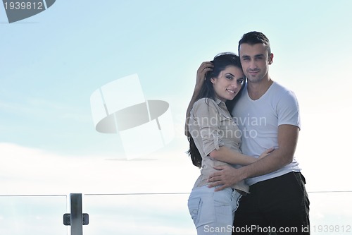 Image of couple relaxing on balcony