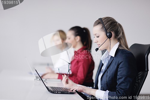 Image of business woman group with headphones