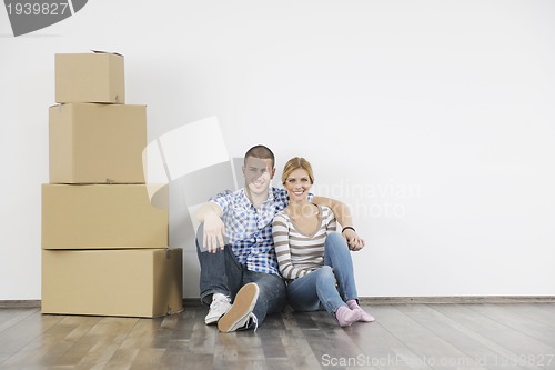 Image of Young couple moving in new home