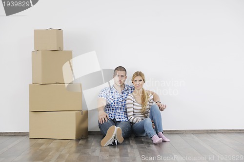 Image of Young couple moving in new home