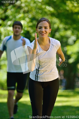 Image of Young couple jogging