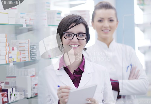 Image of team of pharmacist chemist woman  in pharmacy drugstore