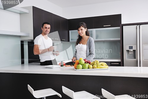 Image of young couple have fun in modern kitchen