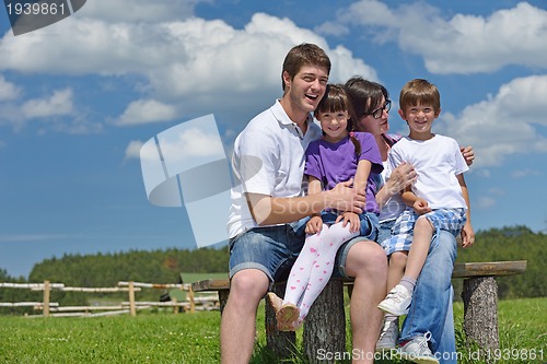 Image of happy young family have fun outdoors