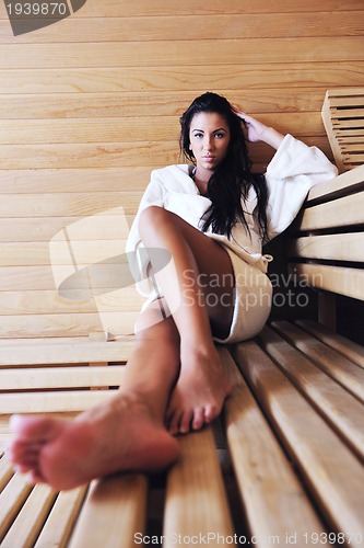 Image of Young woman take a steam bath