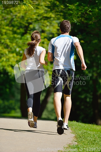 Image of Young couple jogging