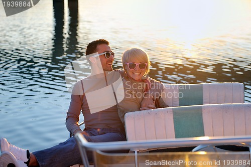 Image of couple in love  have romantic time on boat