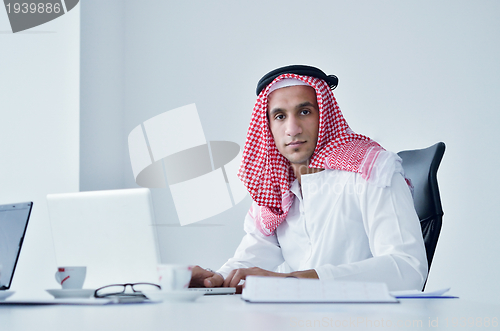 Image of arab business man at bright office