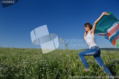 Image of young woman in wheat field at summer