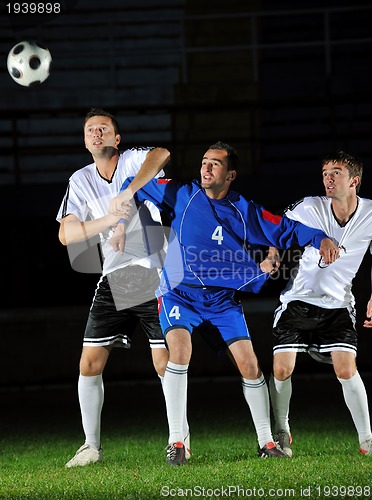 Image of football players in action for the ball