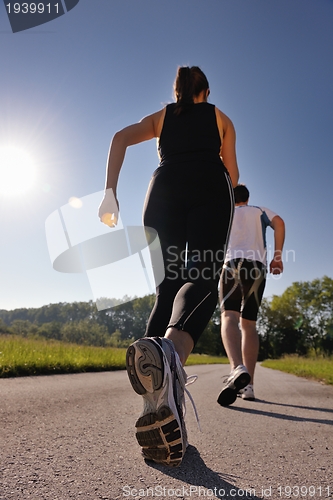 Image of Young couple jogging