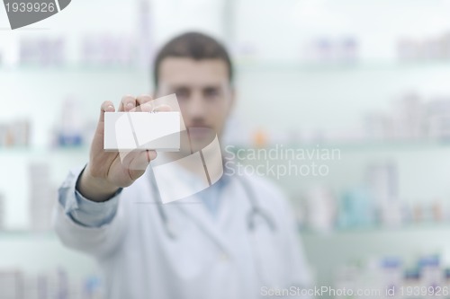 Image of pharmacist chemist man in pharmacy drugstore
