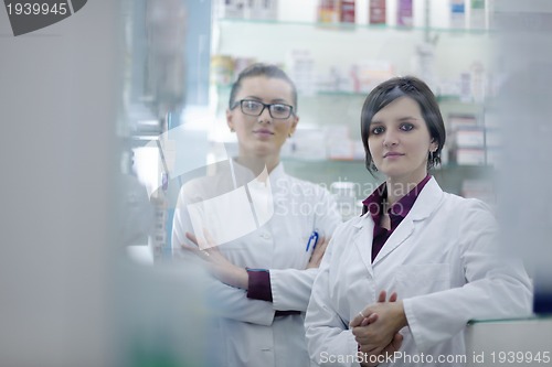 Image of team of pharmacist chemist woman  in pharmacy drugstore