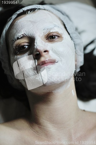 Image of woman with facial mask in cosmetic studio