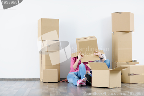 Image of Young couple moving in new house