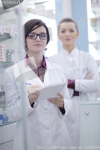 Image of team of pharmacist chemist woman  in pharmacy drugstore