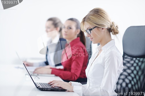 Image of business woman group with headphones