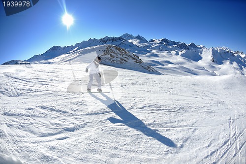 Image of skiing on fresh snow at winter season at beautiful sunny day