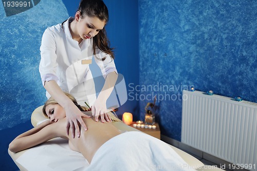 Image of Beautiful young woman in spa