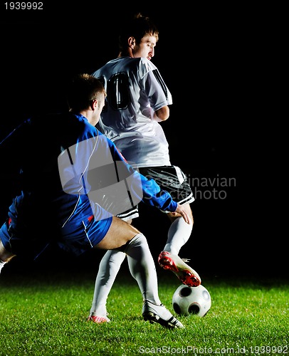 Image of football players in action for the ball