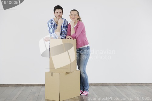 Image of Young couple moving in new home