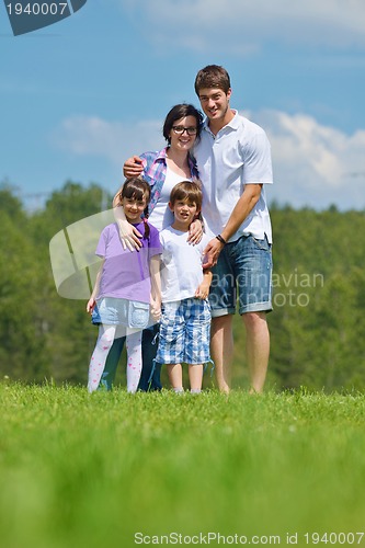 Image of happy young family have fun outdoors
