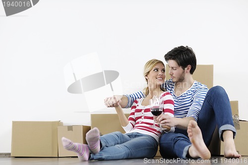 Image of Young couple moving in new home