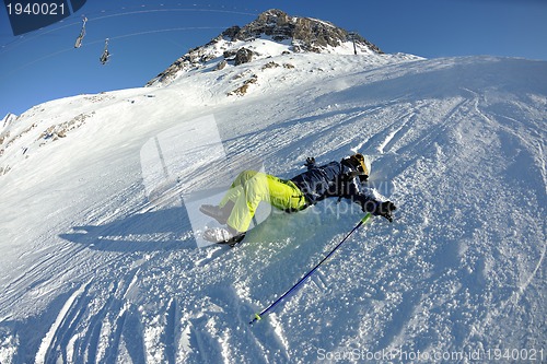 Image of skiing on fresh snow at winter season at beautiful sunny day