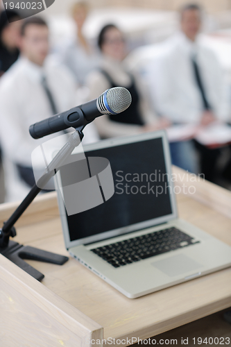 Image of laptop on conference speech podium