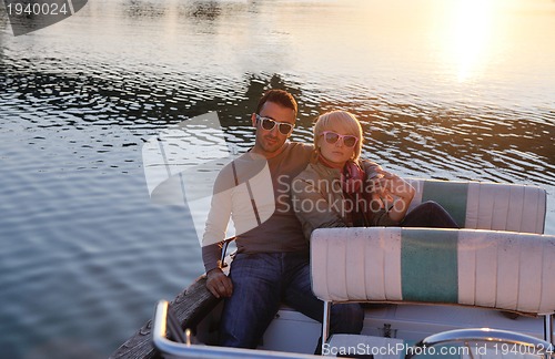 Image of couple in love  have romantic time on boat