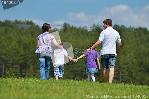 Image of happy young family have fun outdoors