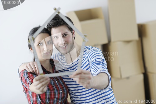 Image of Young couple moving in new home