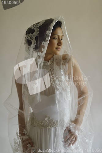 Image of Portrait of a beautiful woman dressed as a bride